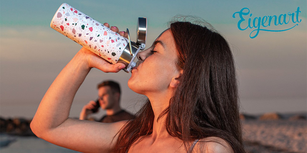 Woman drinking from LEEZA Thermo Drinking Bottle by Eigenart